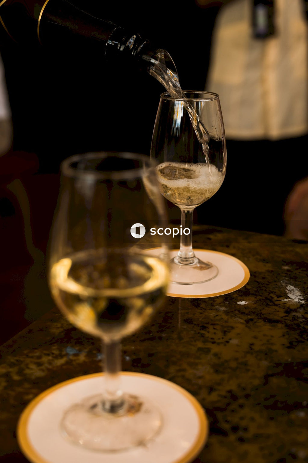 Clear wine glass on brown wooden table