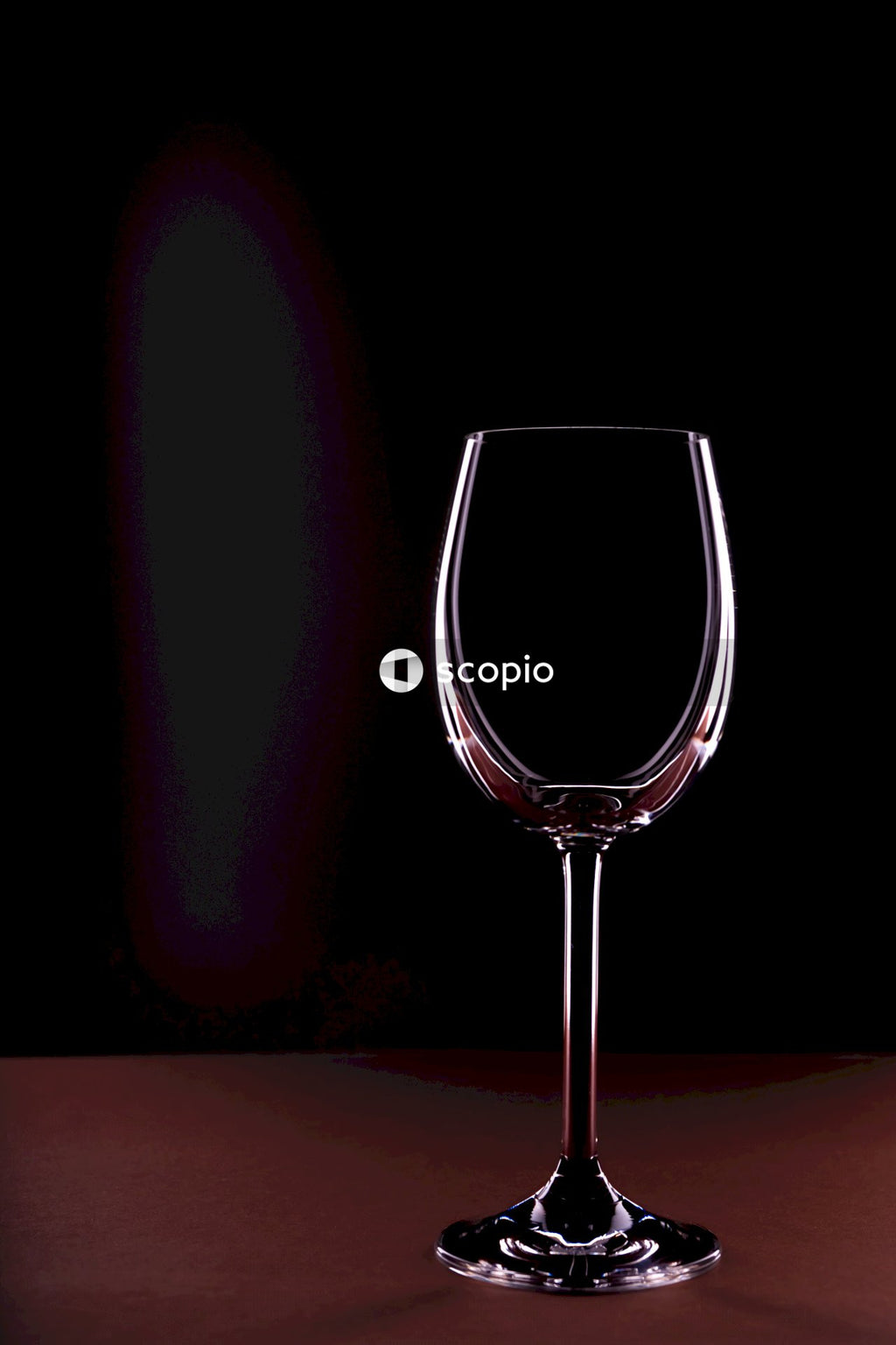 Clear wine glass with black background