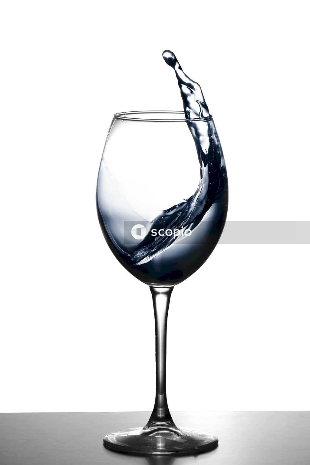 Clear wine glass with white liquid