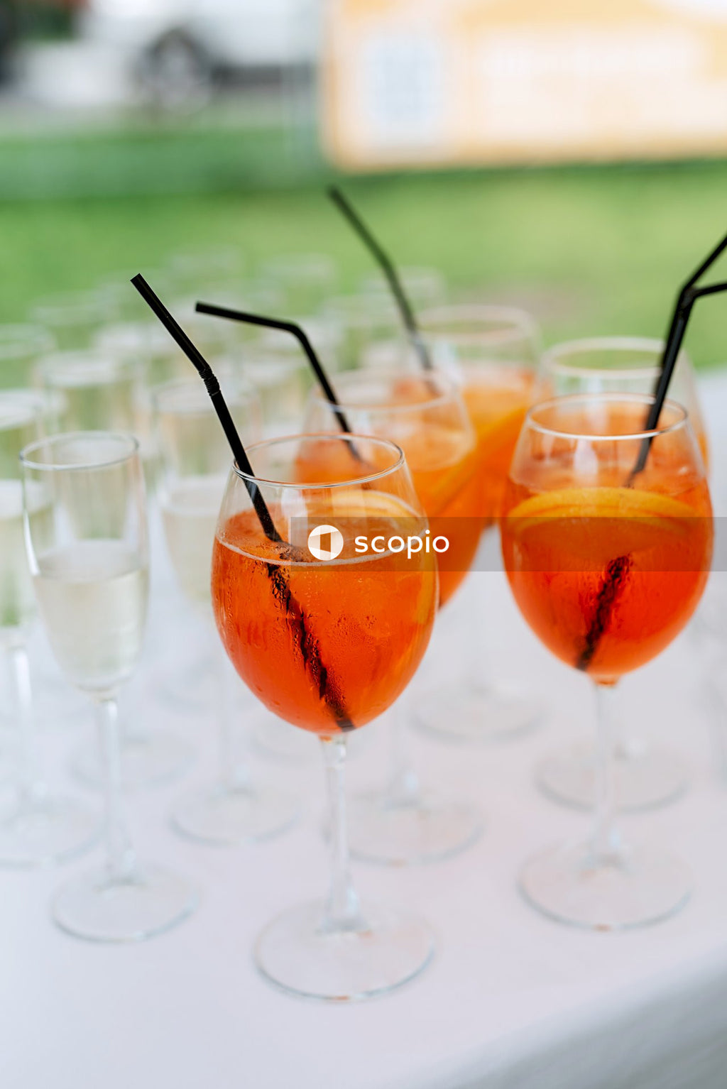 Clear wine glasses with orange liquid