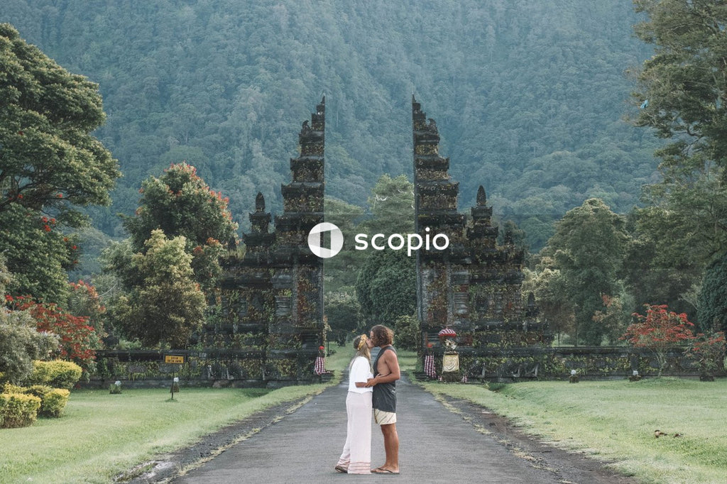 Couple kissing in front of Handara Gate, Bali