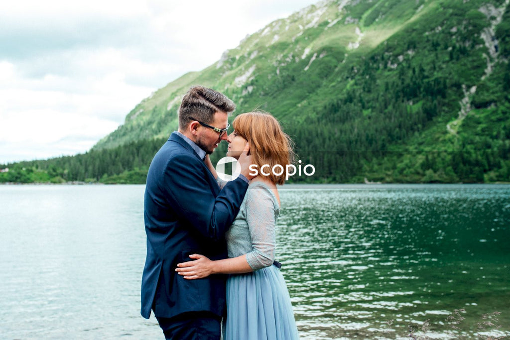 Couple standing on a lake