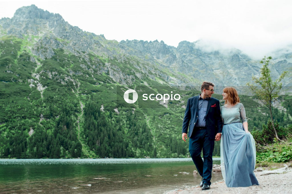 Couple standing on lake side