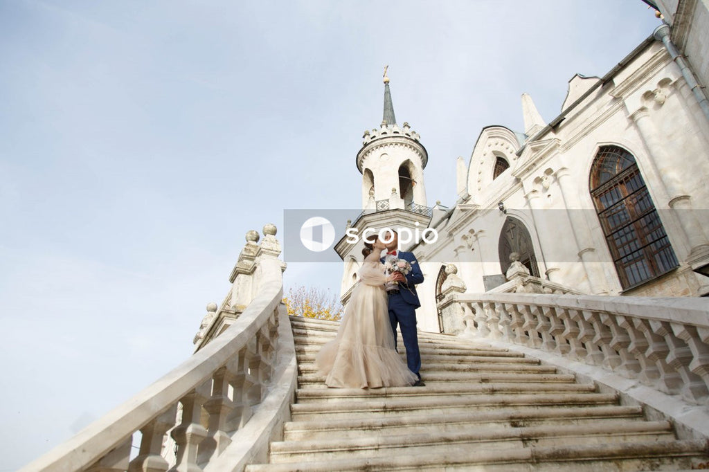 Couple walking on white staircase