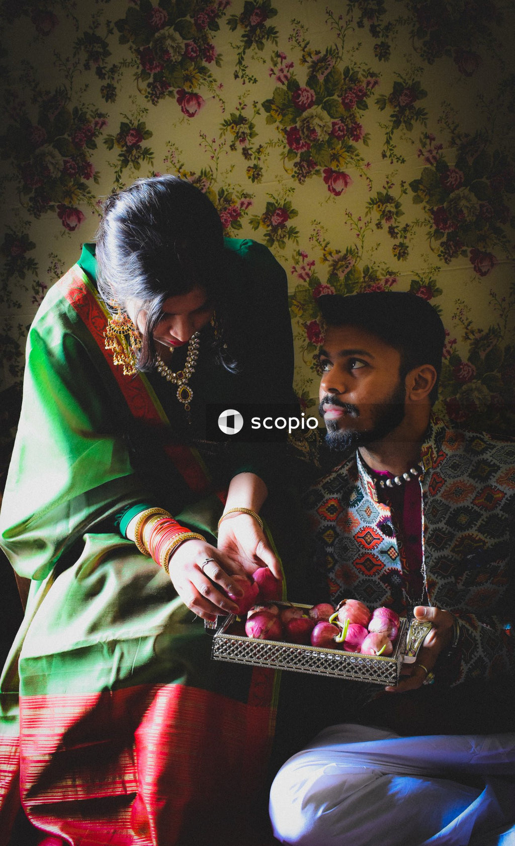 Couple wearing traditional clothing indoors
