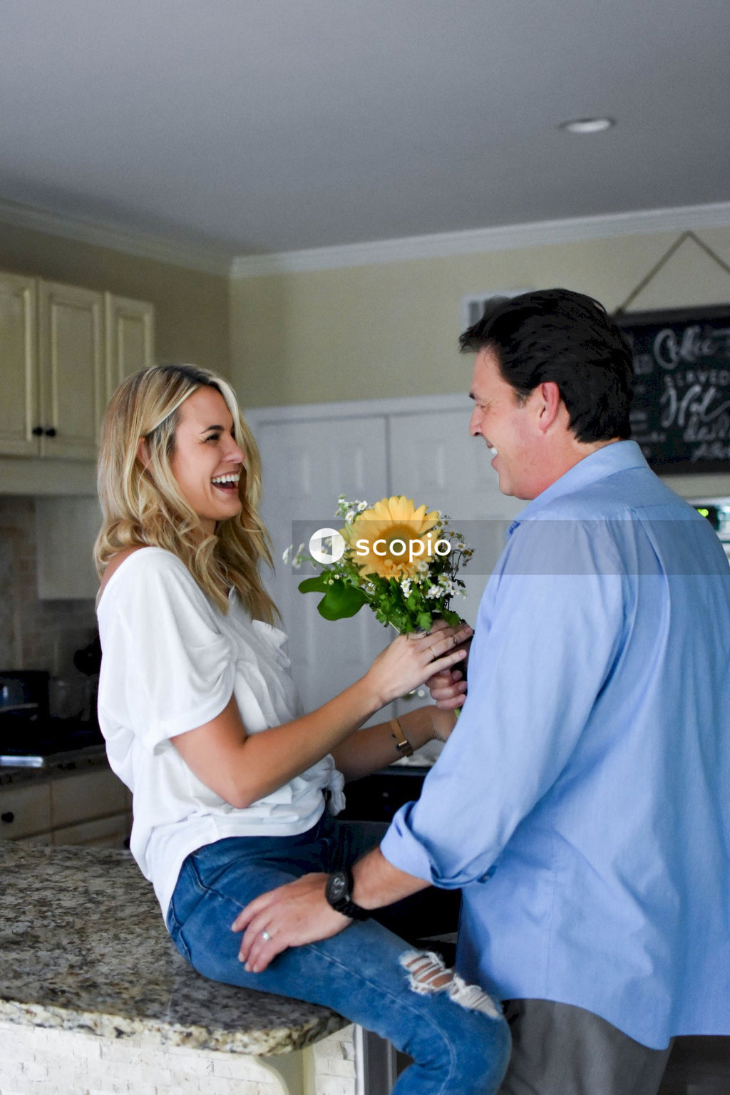 Man offering flower to a woman