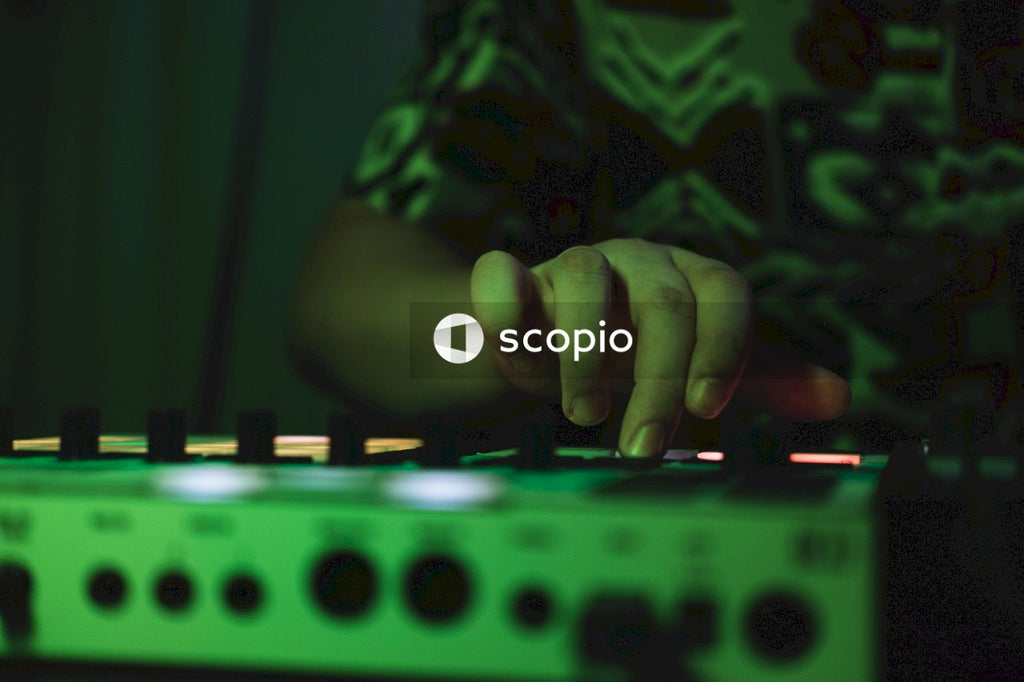 Person holding audio mixer