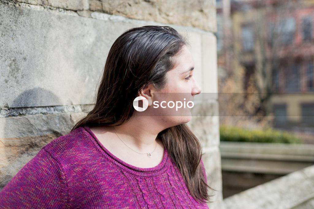 Woman in purple knit shirt