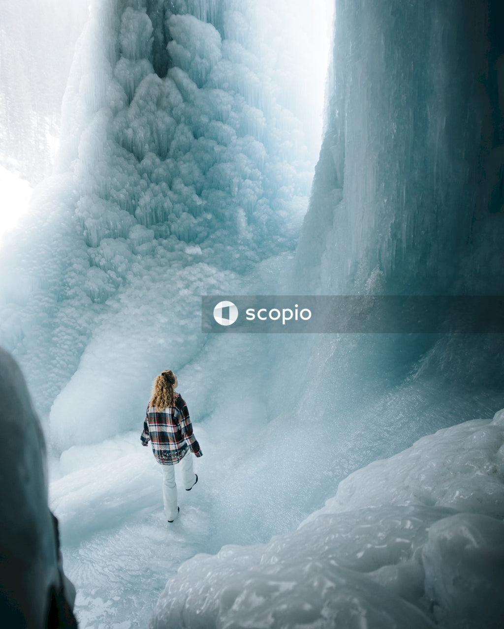 Woman walking on snow covered ground