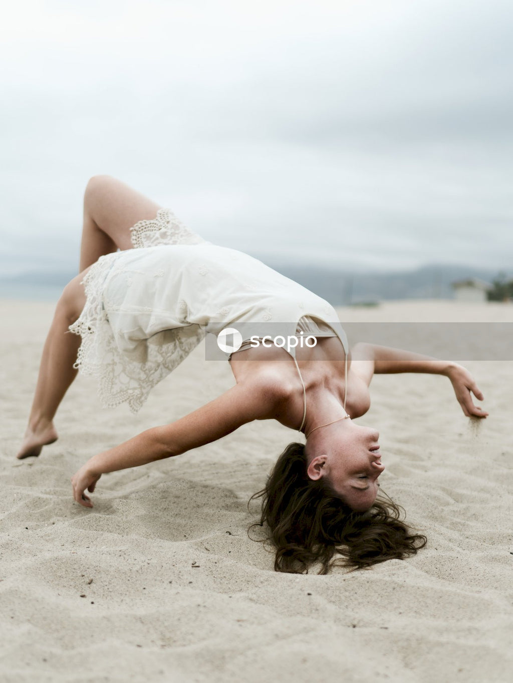 Woman floating above sand