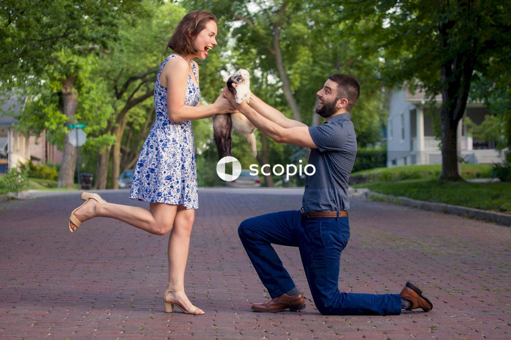 Man kneeling in front of a woman