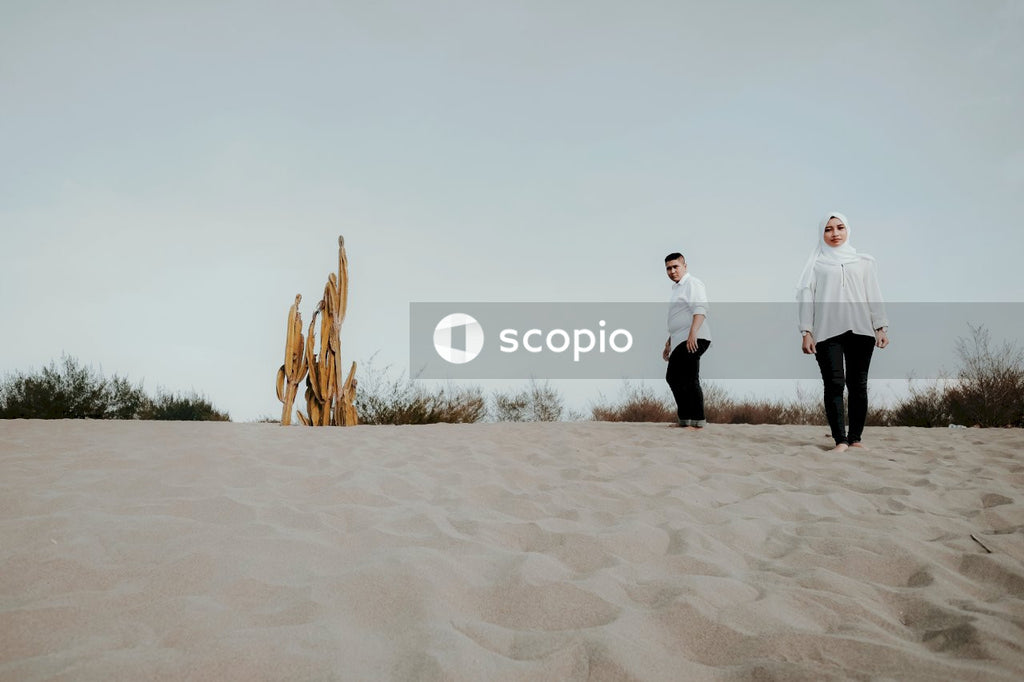 Couple walking on sand