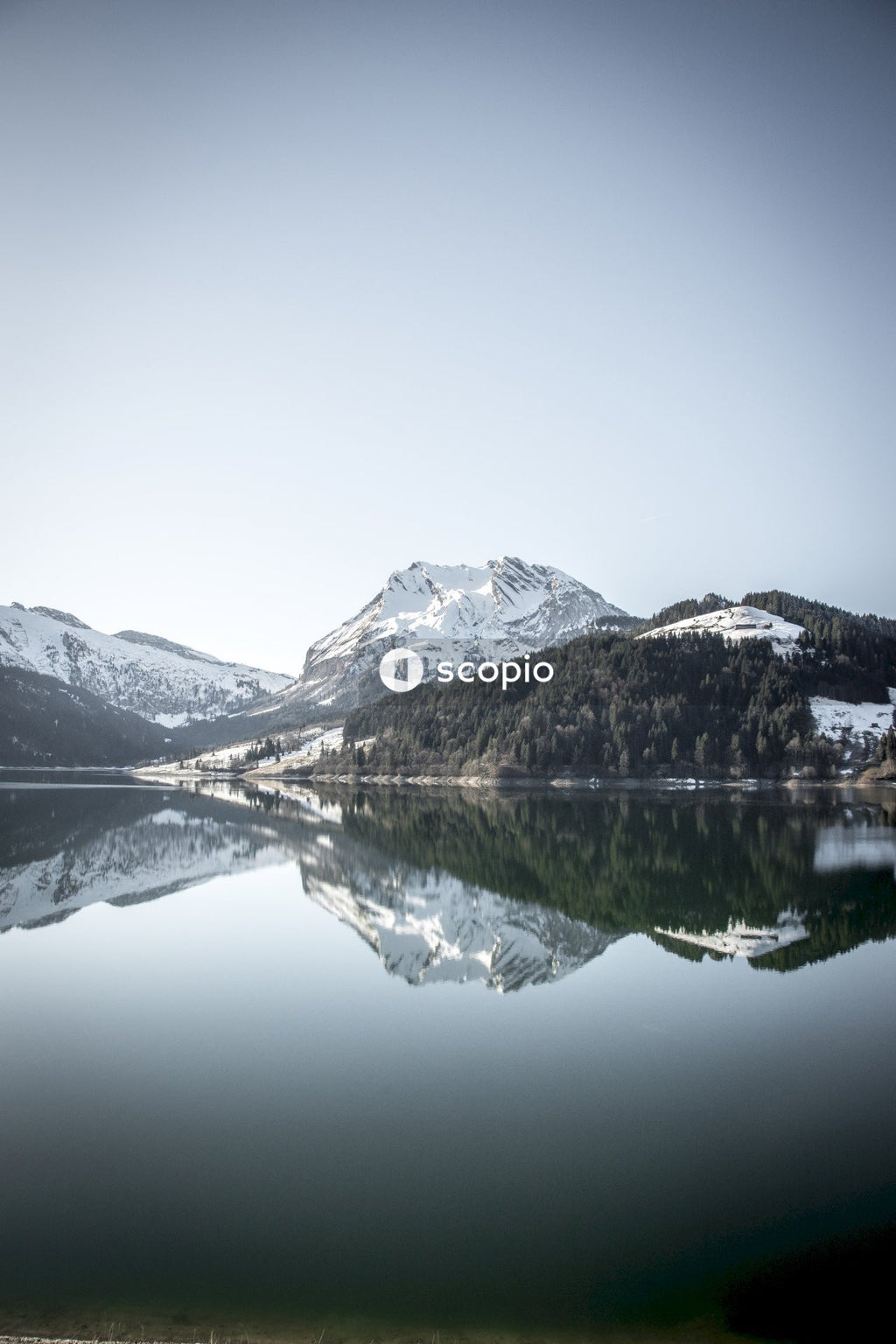 Lake near snow covered mountain