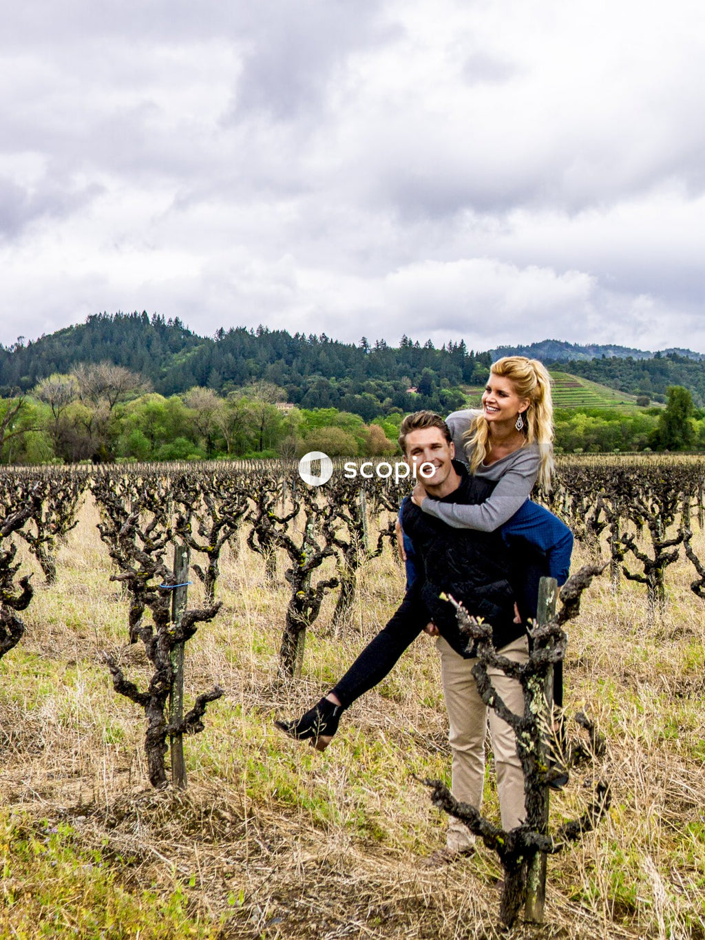 Woman riding on man's back at daytime