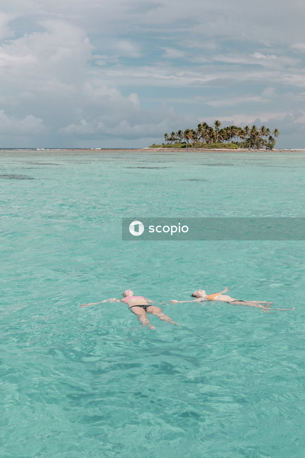 Women floating in sea