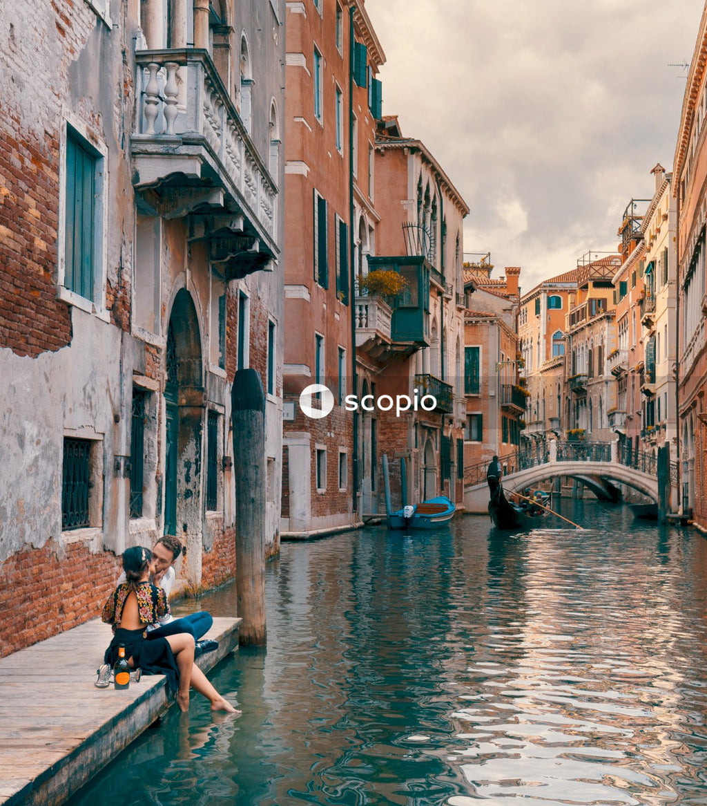 Couple kissing upon canal