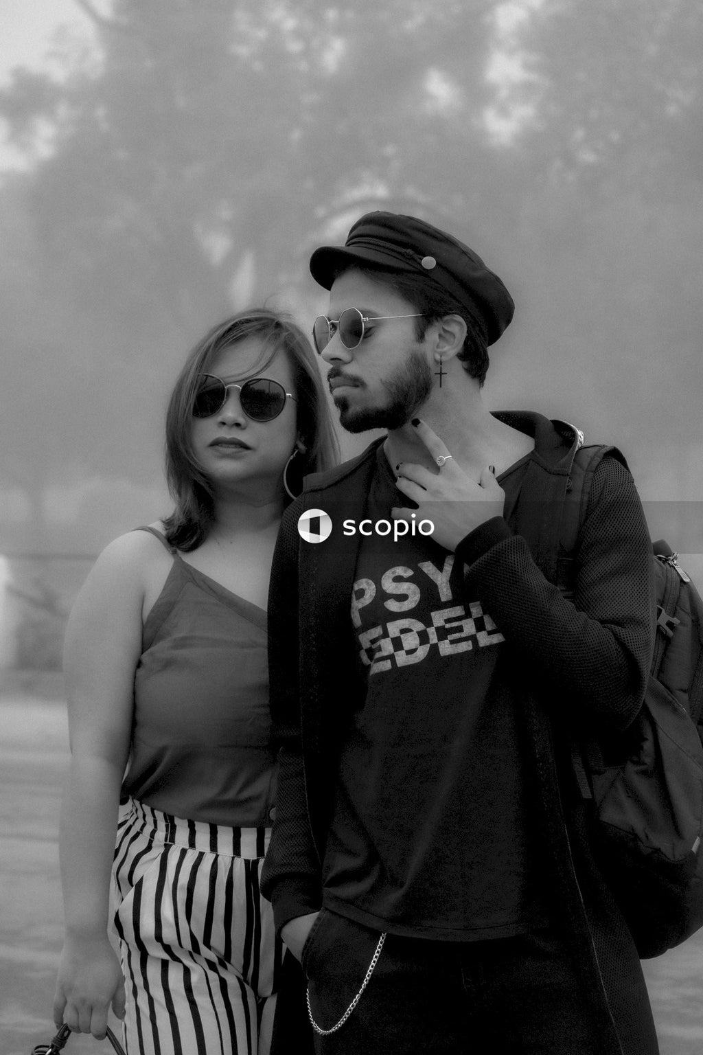 Grayscale photo of couple kissing