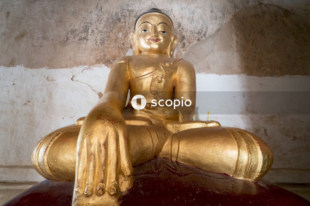 Gold sitting buddha figurine