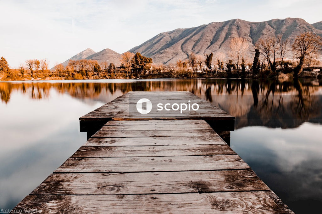 Brown wooden dock on lake