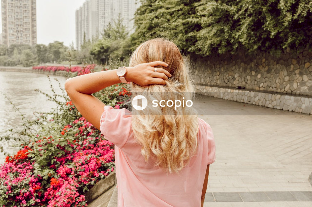 Woman’s Pink Shirt Matches With the Pink Flowers of Nature
