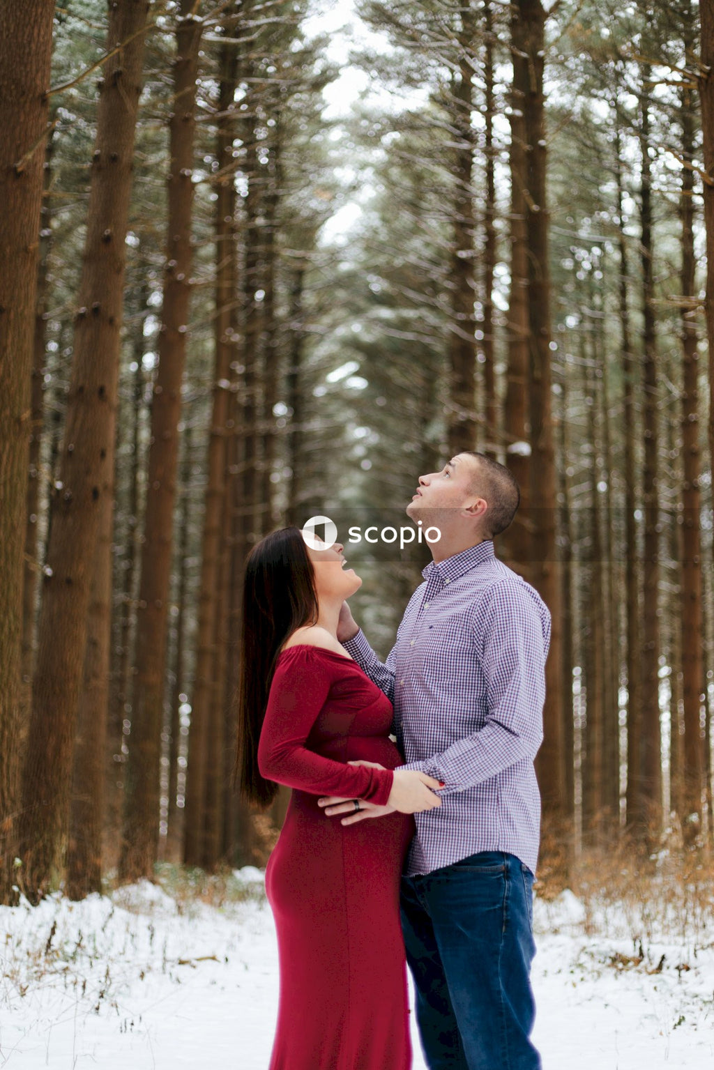 Man and woman standing in forest