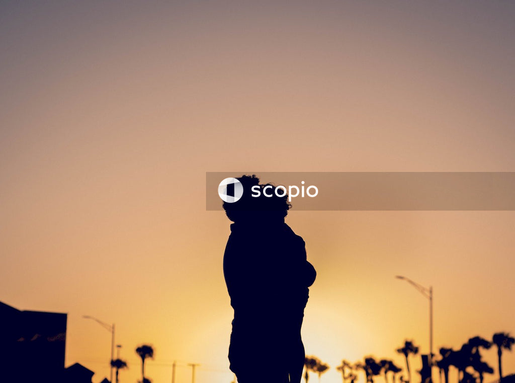 Silhouette of two person hugging each other