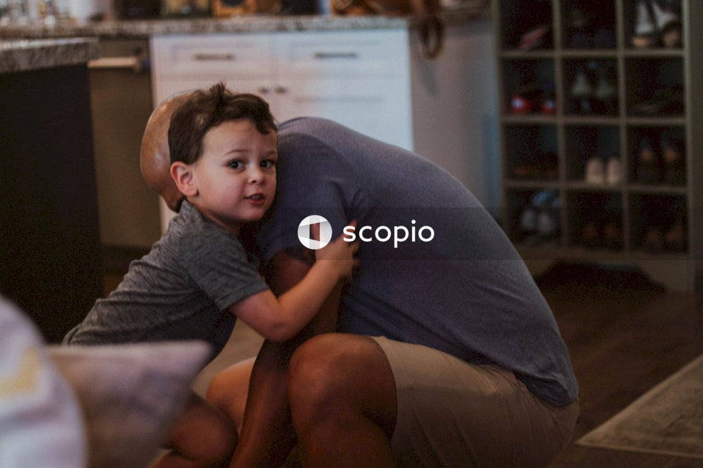 Father tying his son's shoelace