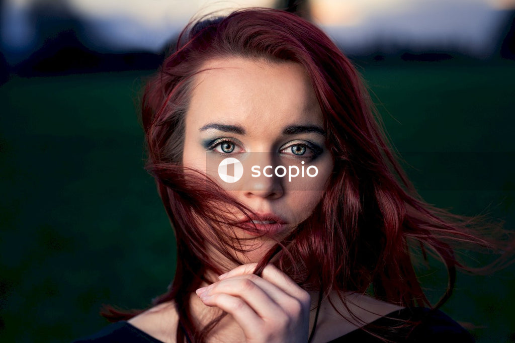 Woman with red hair and red lipstick