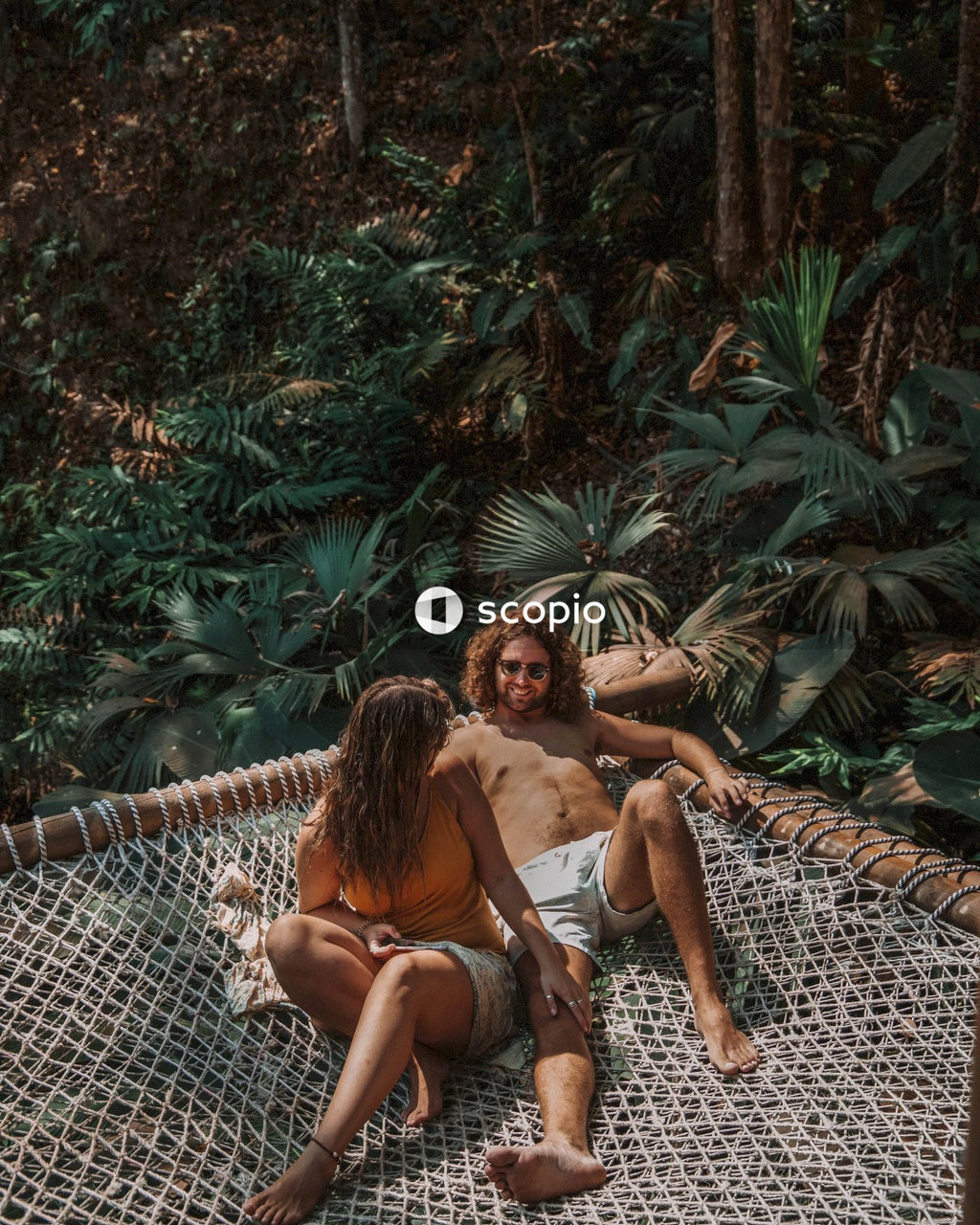 Couple relaxing on hammock