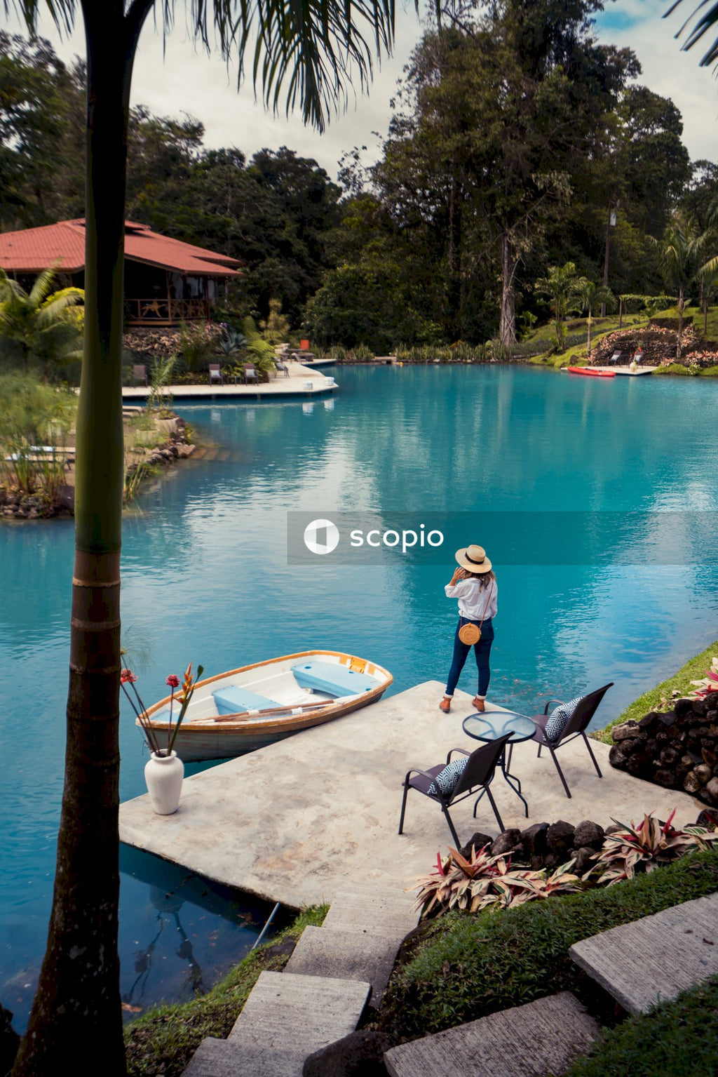 Woman standing beside swimming pool