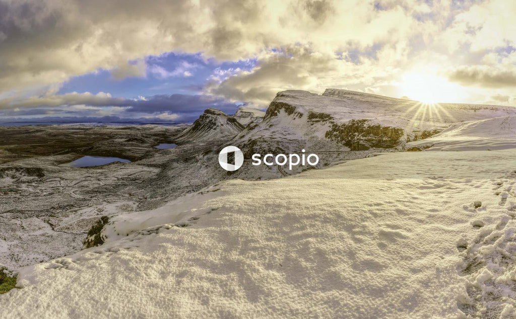 Snow covered mountain under cloudy sky
