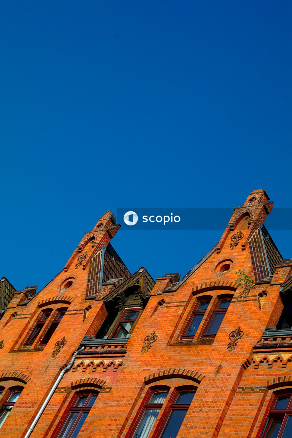 Pointed-roof brick homes