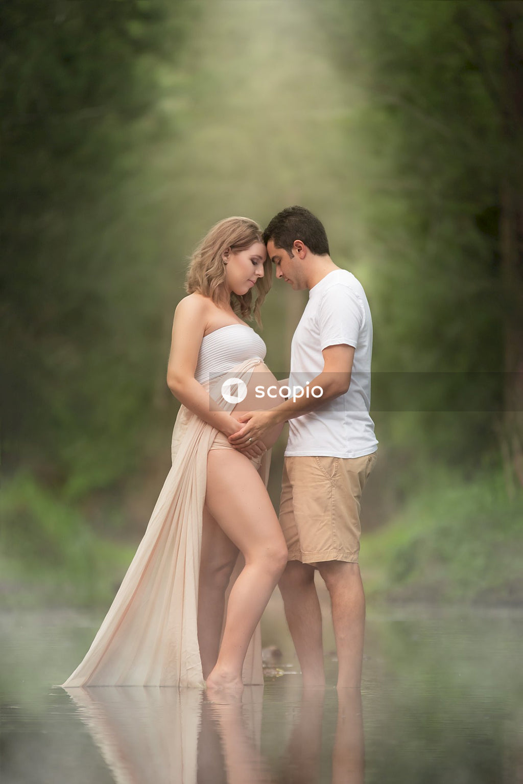 Man and woman kissing on river