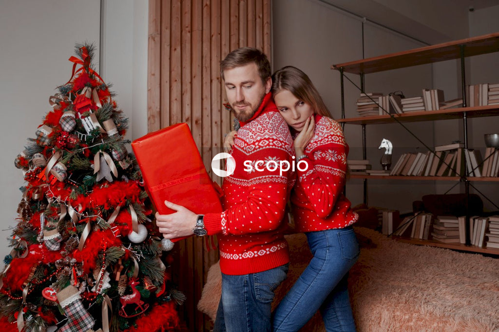 Couple standing beside bed