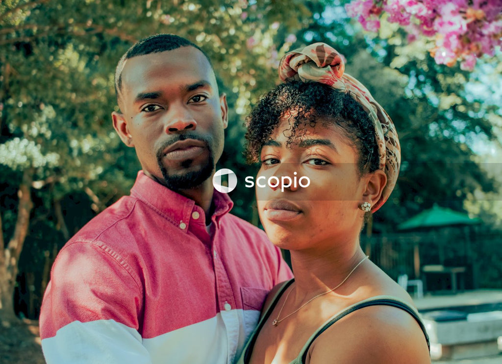 Black man and woman hugging outdoor