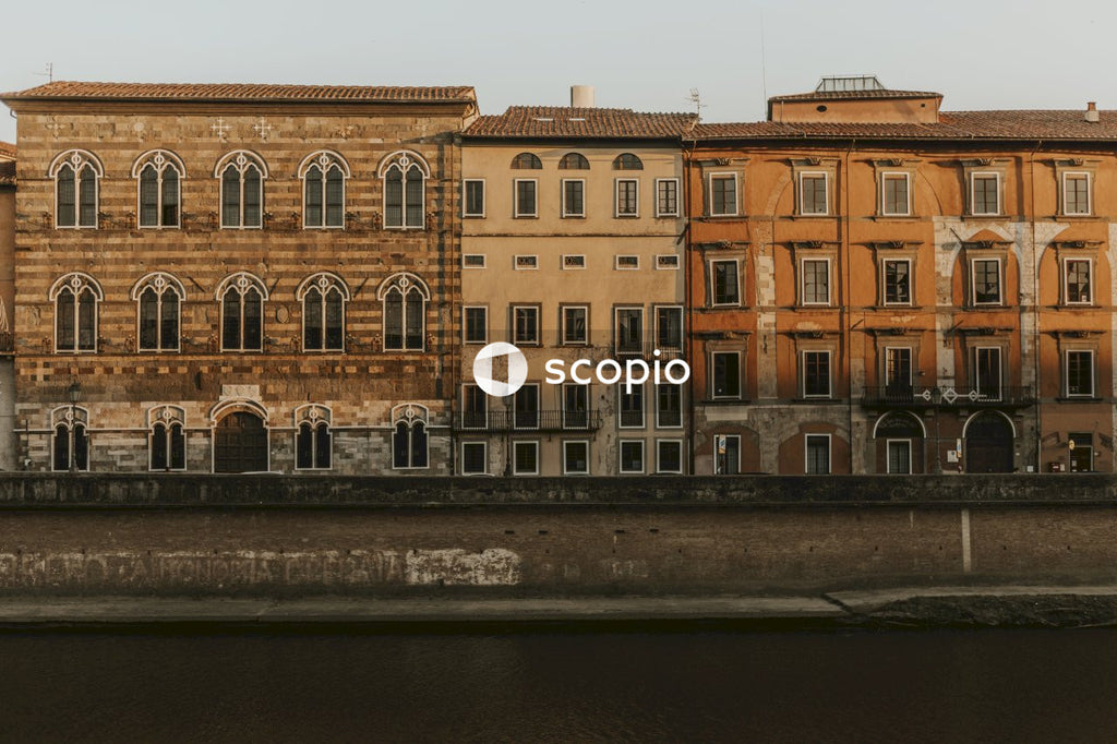 Brown concrete building near body of water