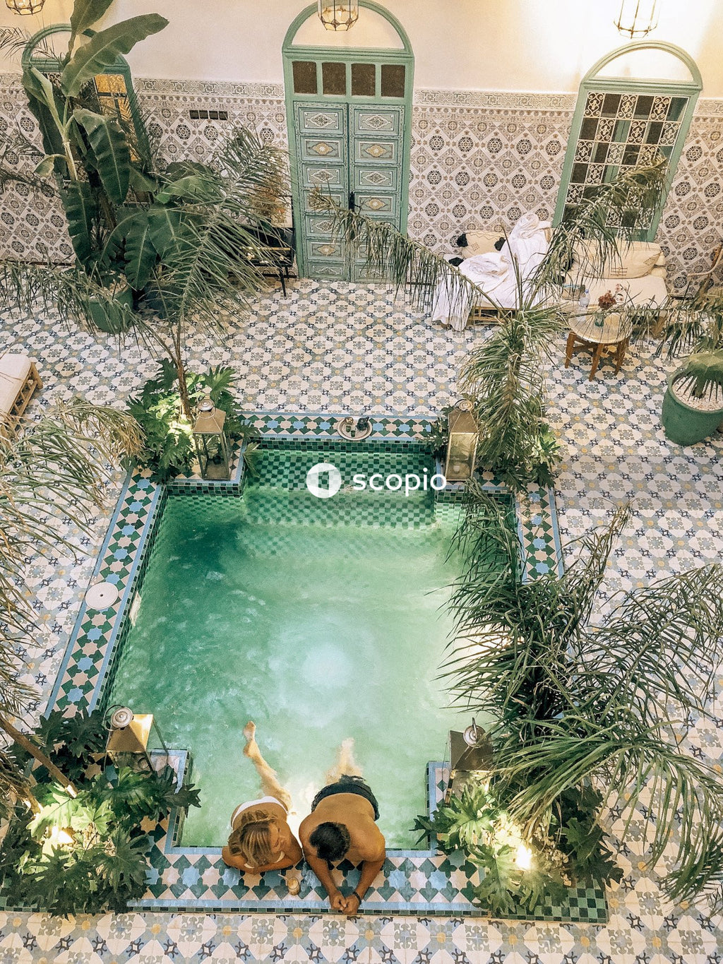 Aerial photo of couple swimming on pool