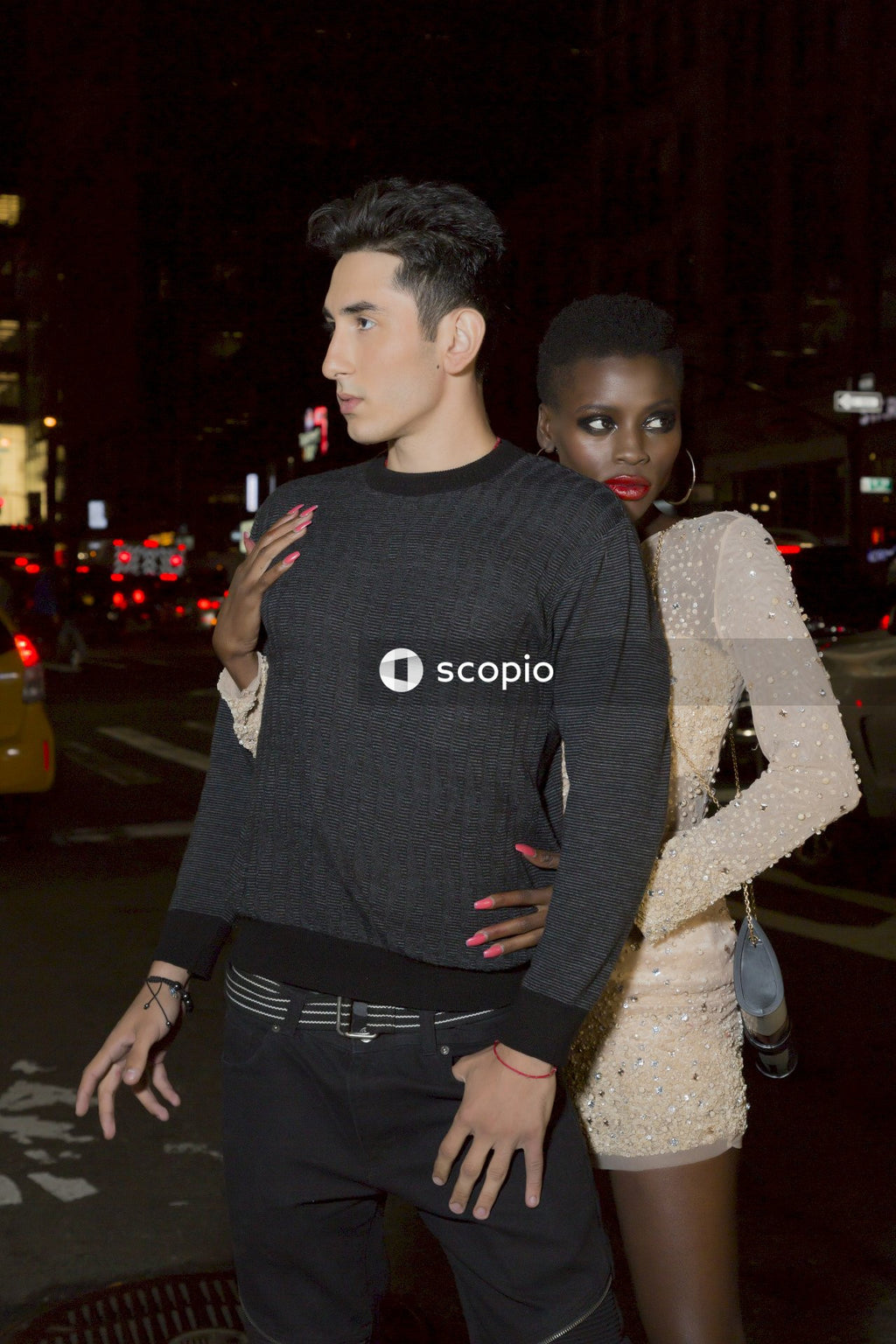 Couple on a date posing on street