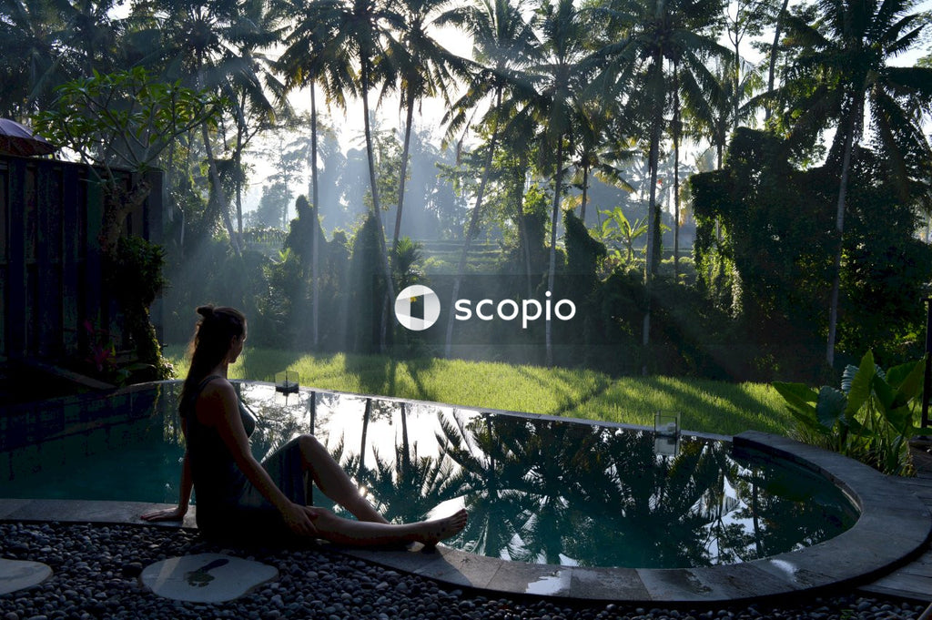 Woman sitting on poolside
