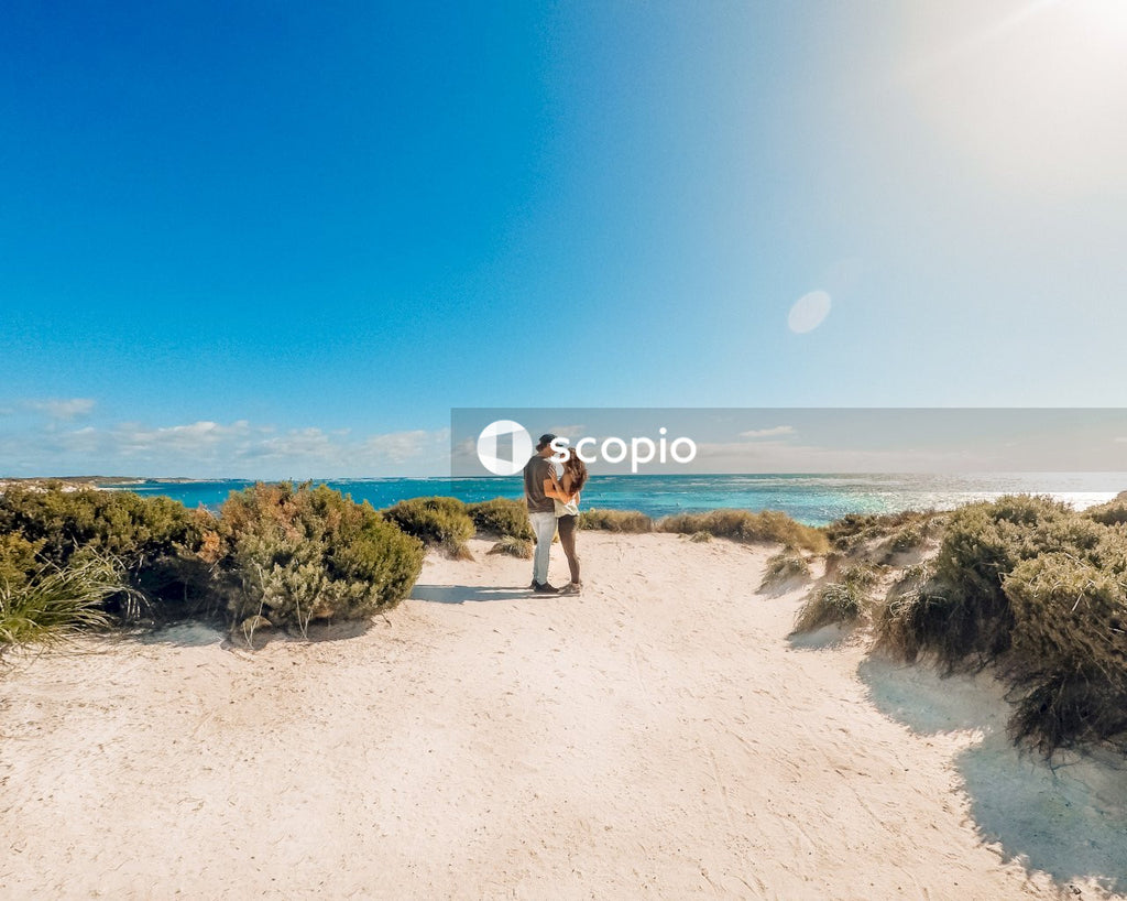 Couple standing near sea