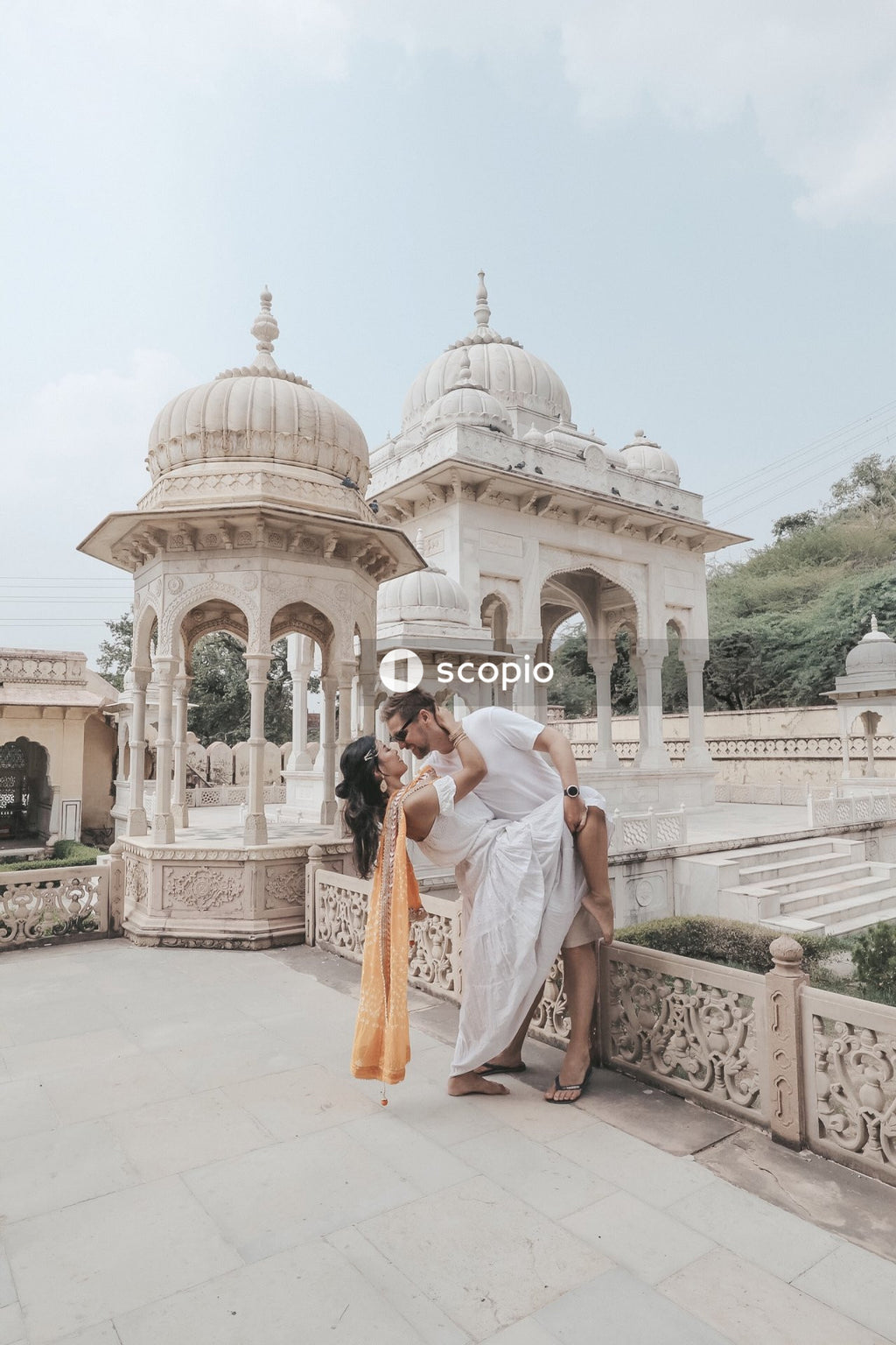 Couple about to kiss at the exterior of Gaitor Ki Chhatriyan in Jaipur, Rajasthan