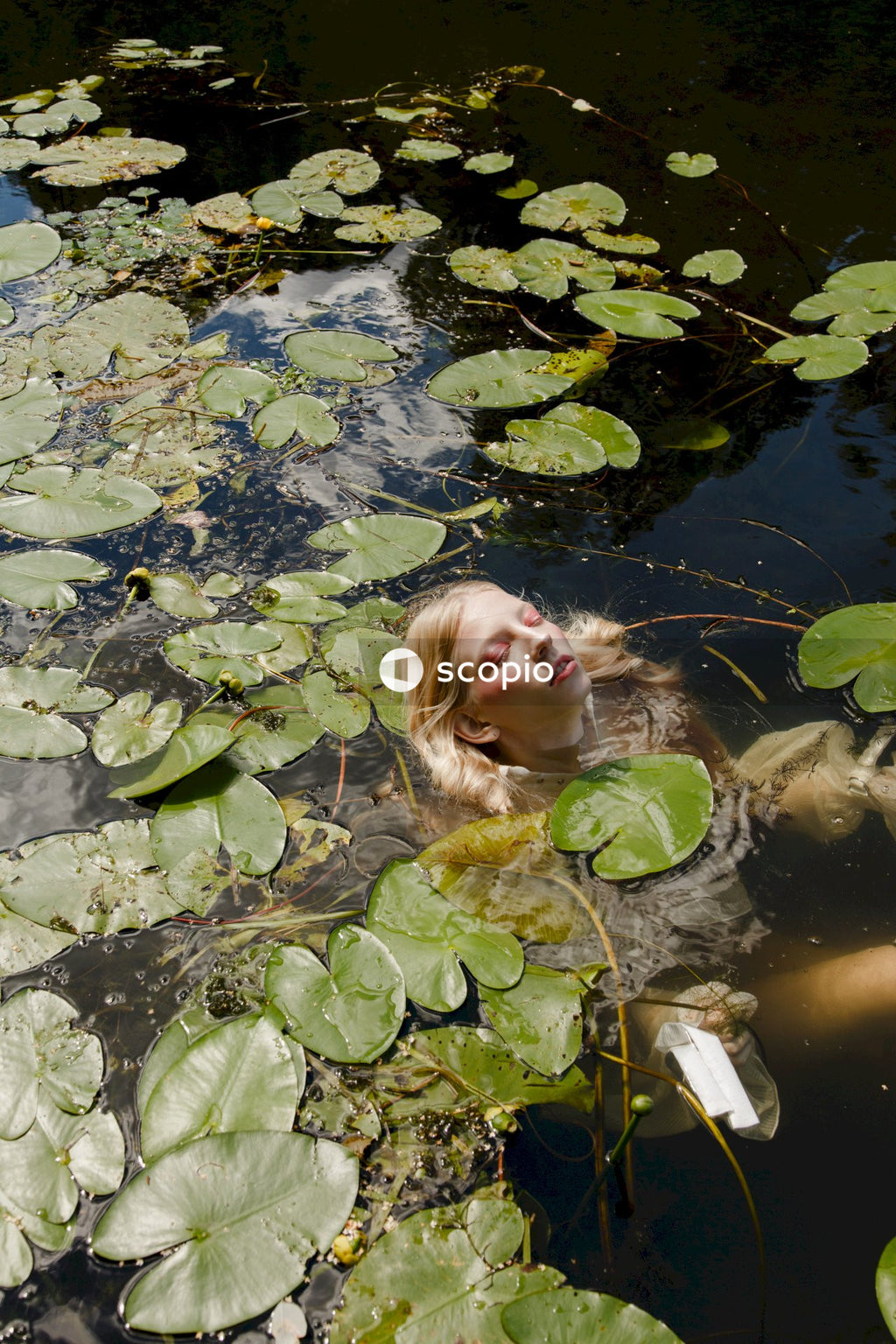 Girl in green shirt on water
