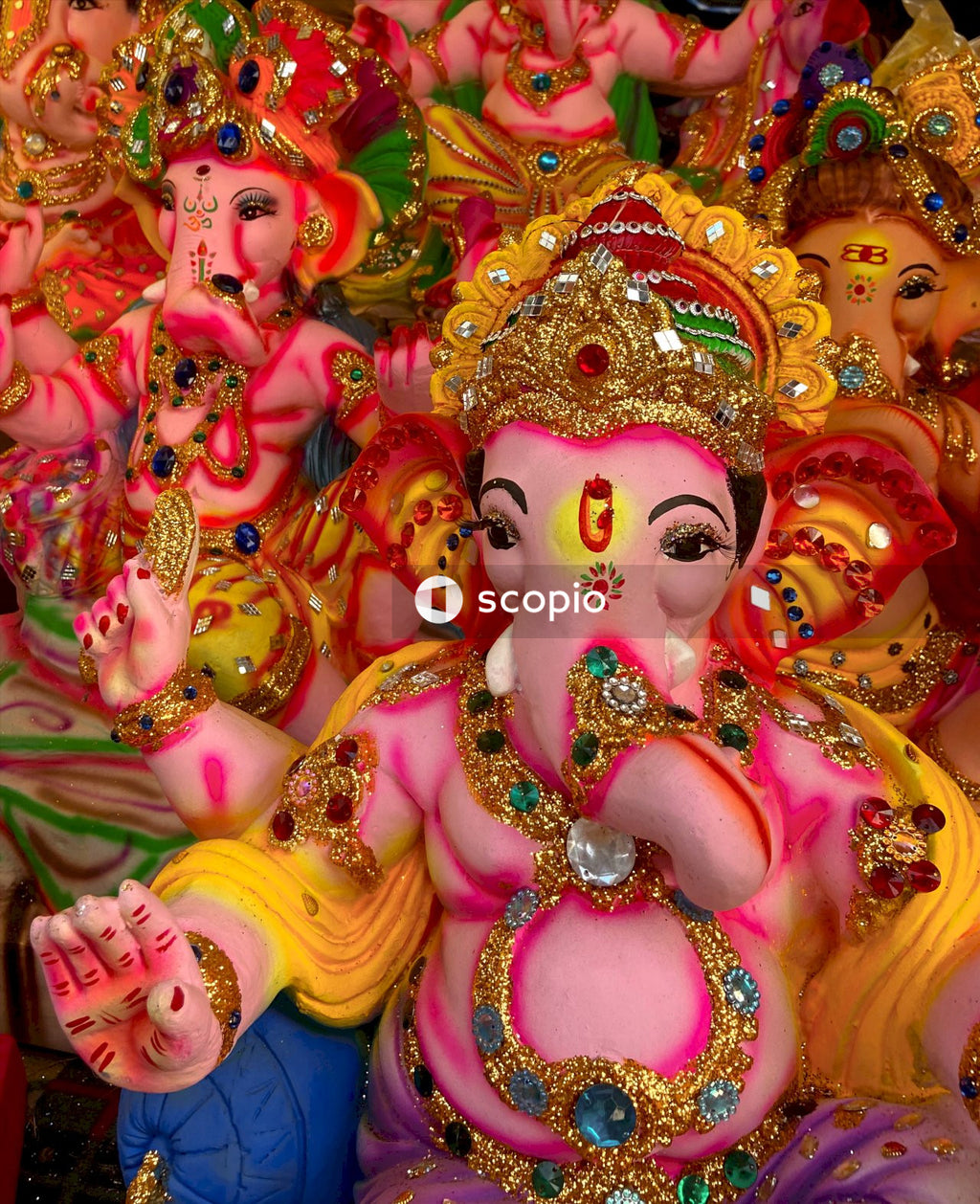 Gold and pink hindu deity figurine