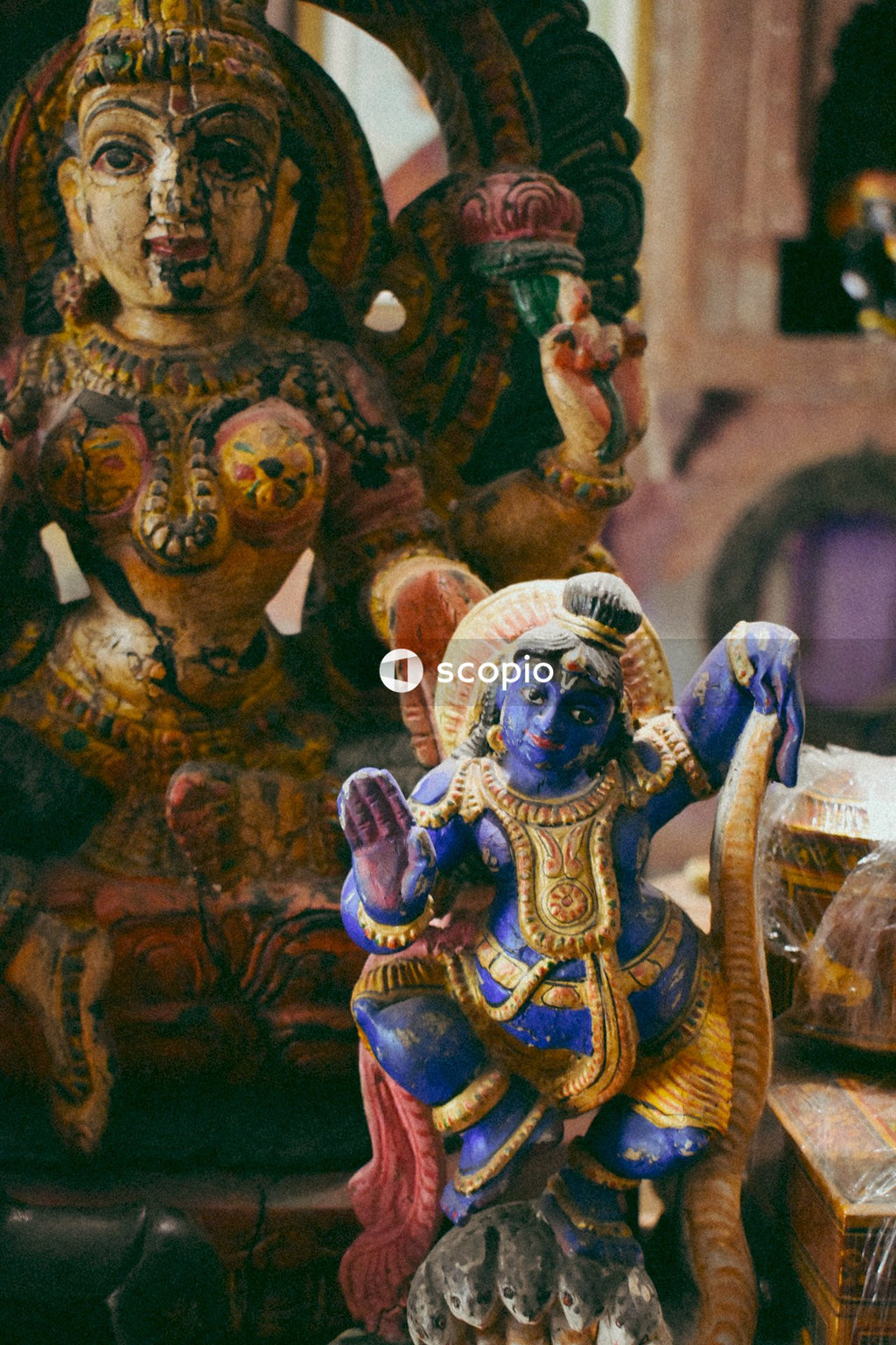 Gold and purple hindu deity figurine