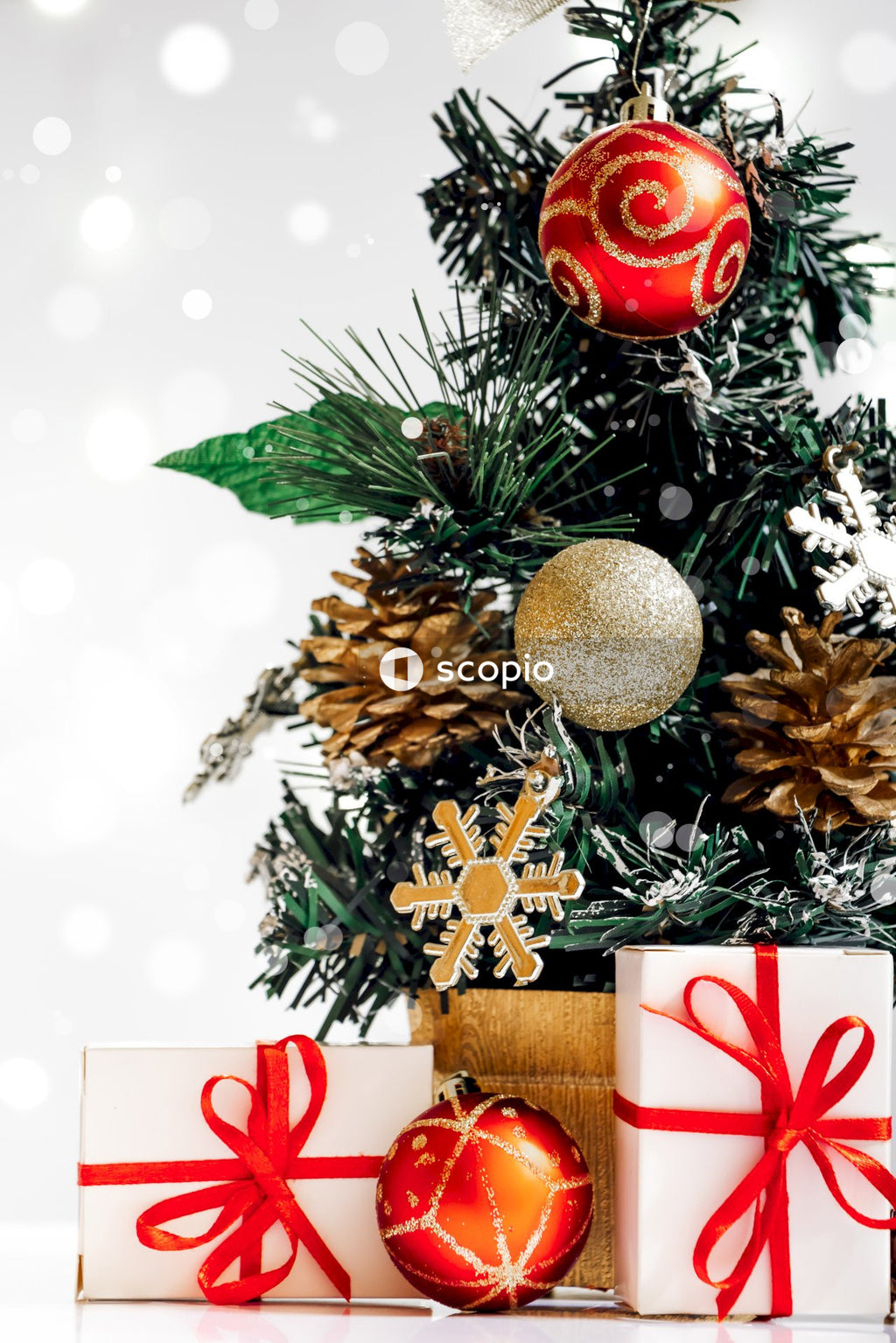 Gold and red baubles on green christmas tree