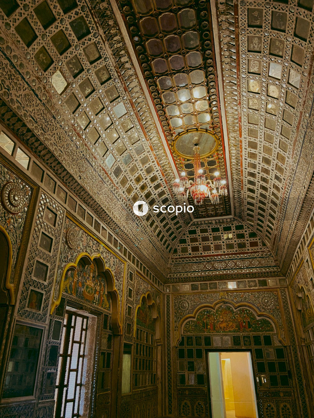 Gold and white ceiling with chandeliers