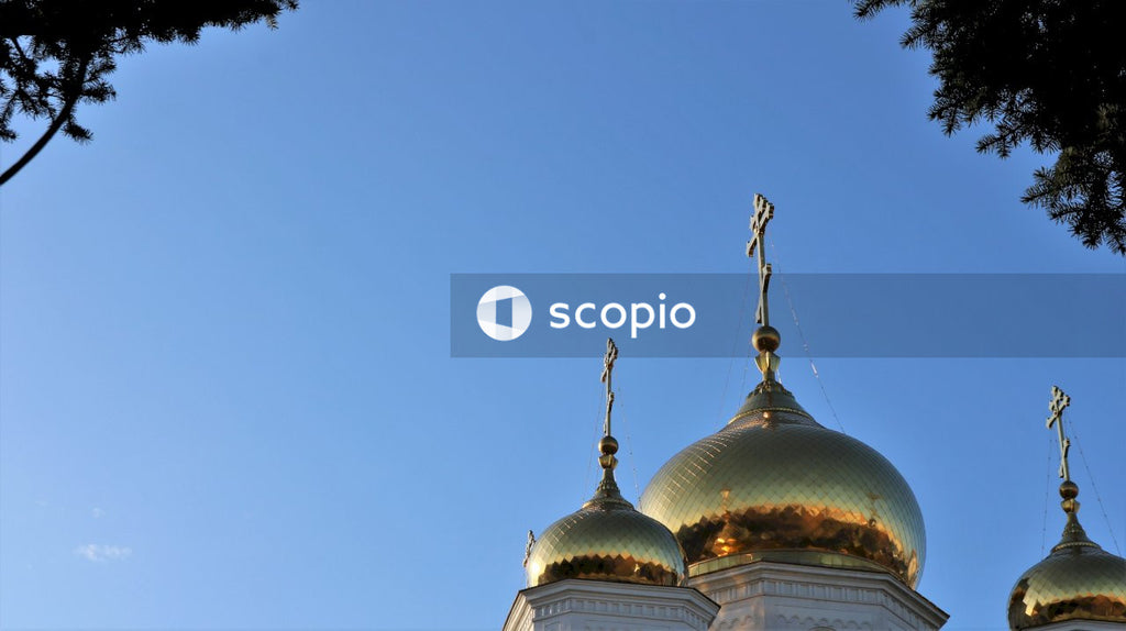 Gold and white dome building under blue sky