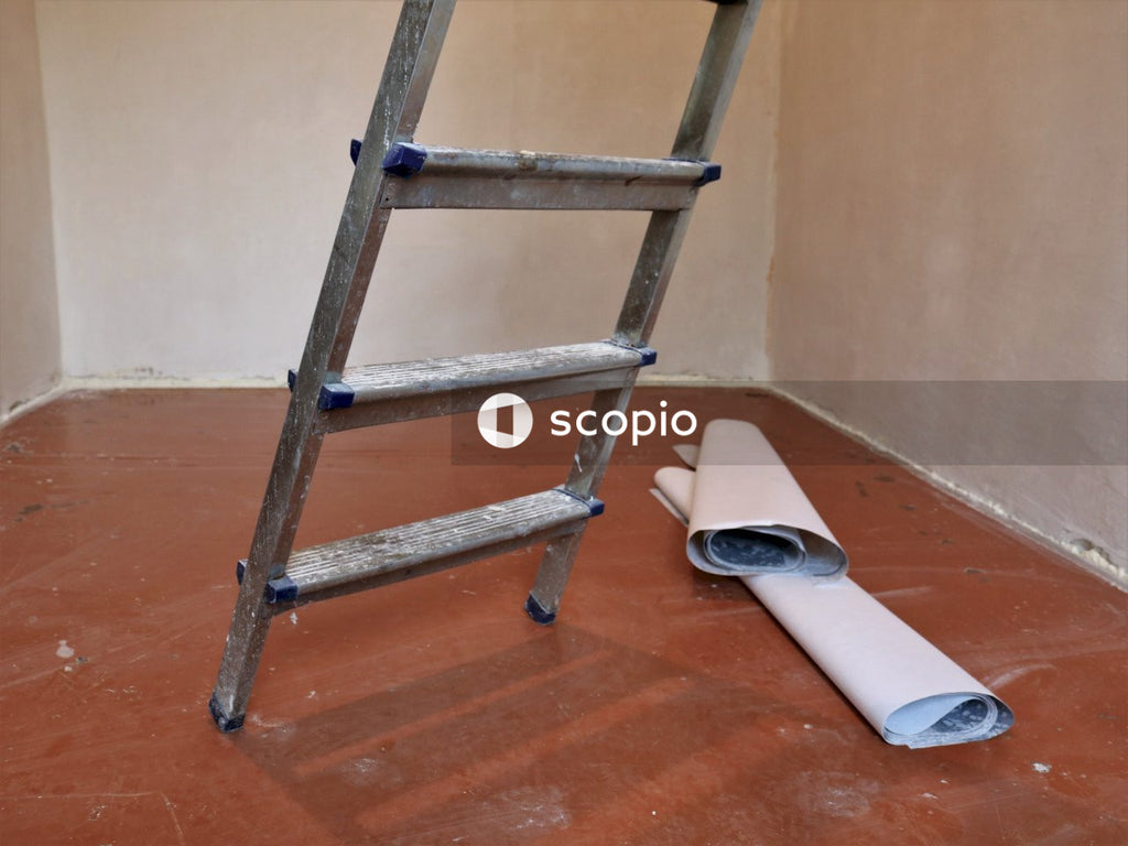 Gray and black step ladder