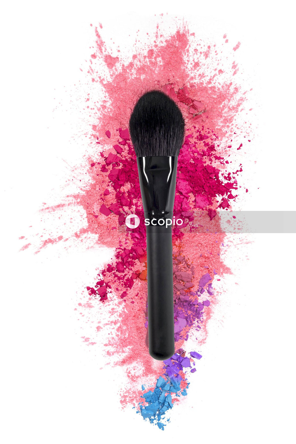 Gray makeup brush on purple textile