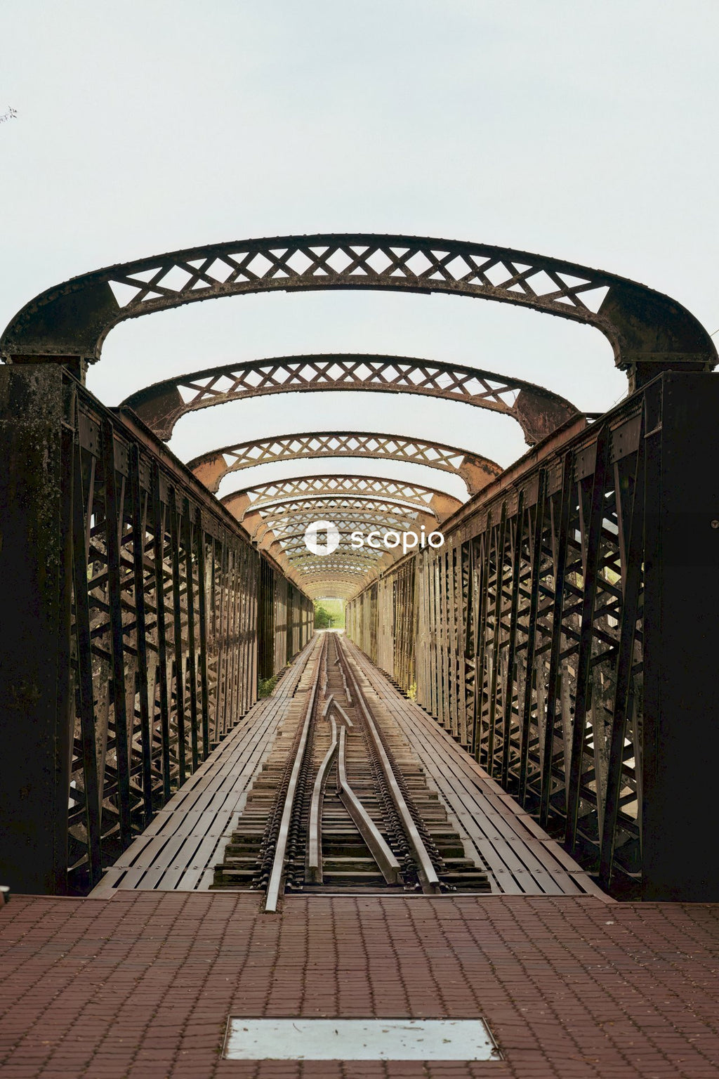 Gray metal bridge under blue sky